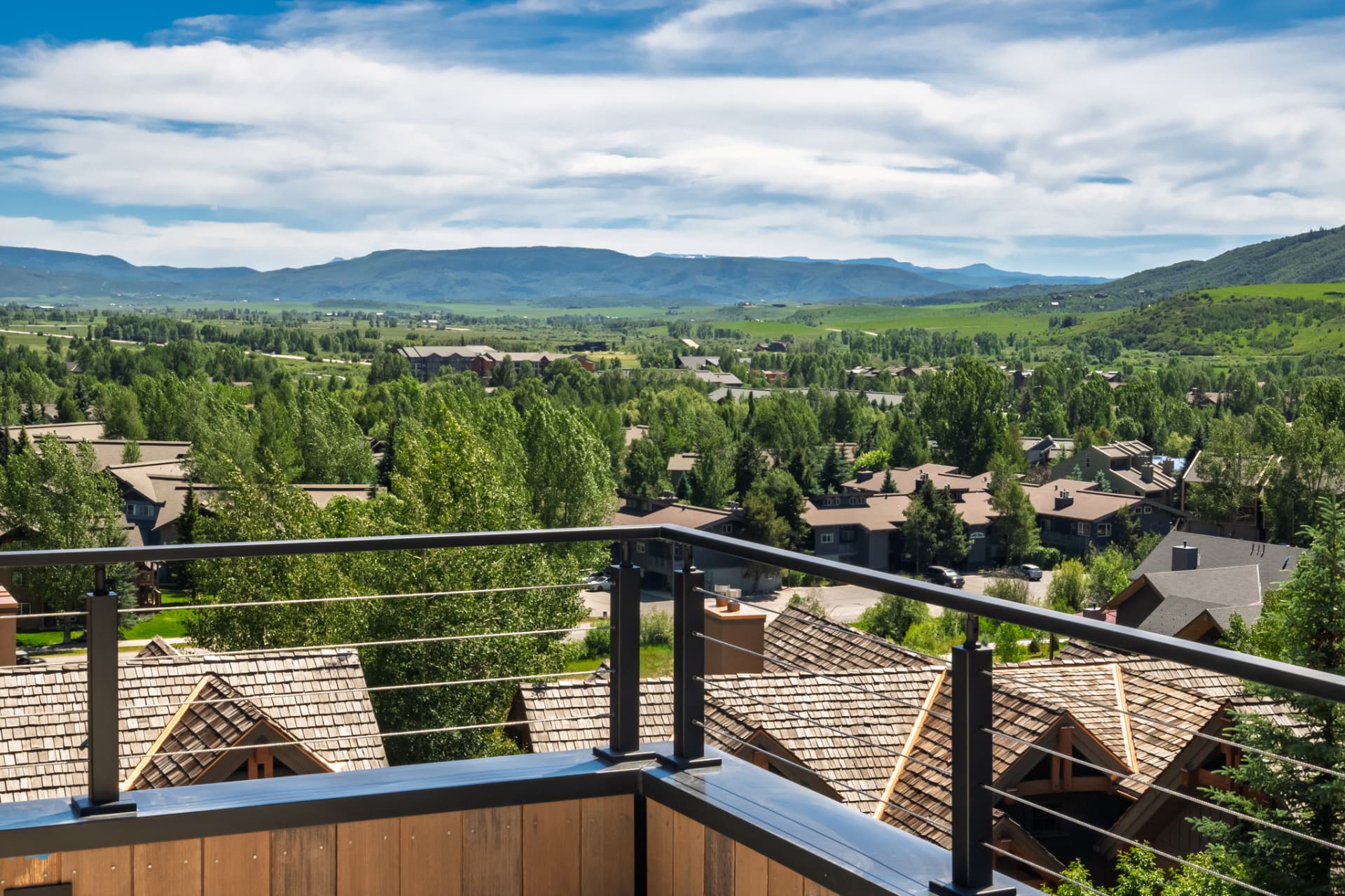 Panoramic view of the Yampa Valley and surrounding mountain ranges from the private rooftop deck