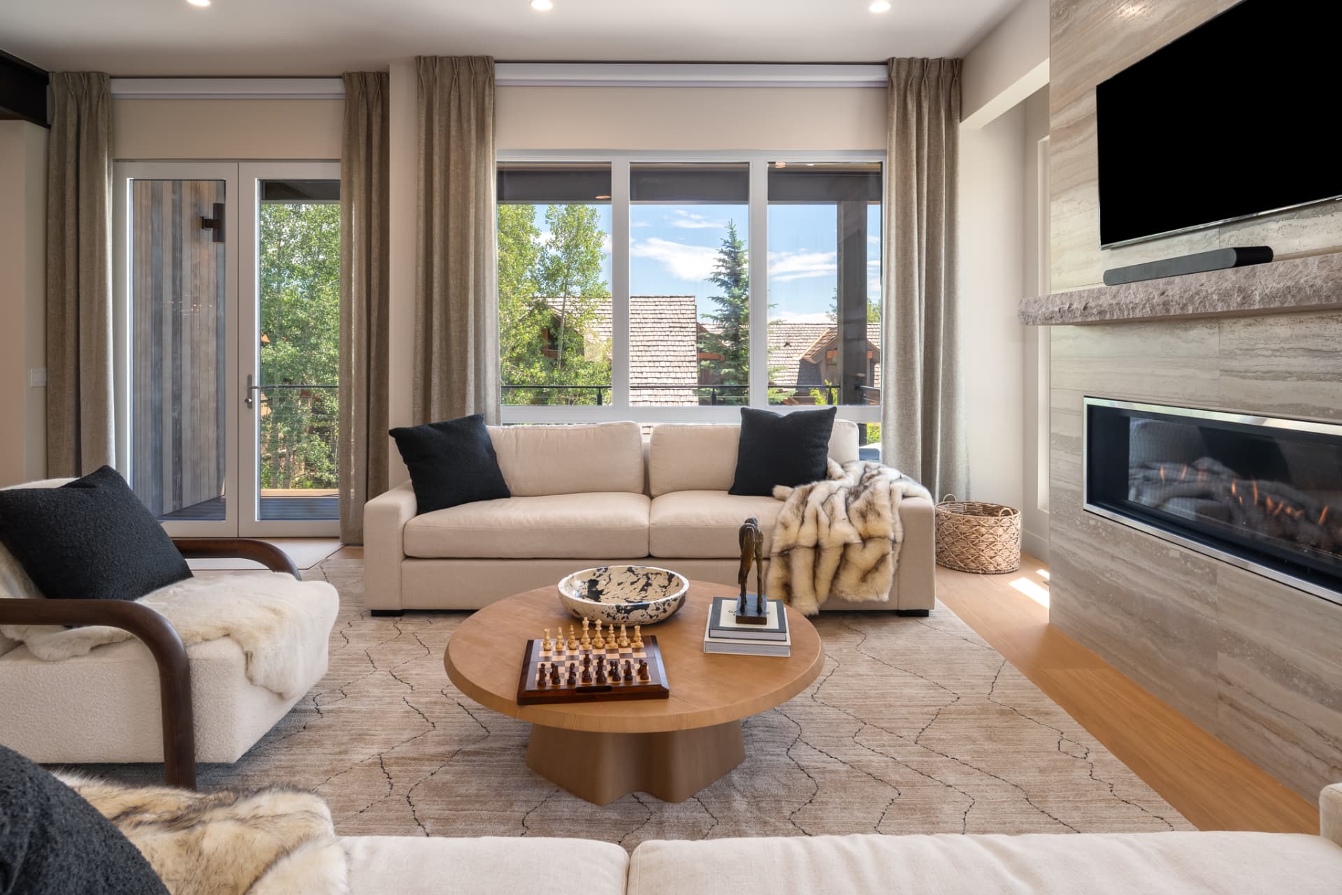Upper lounge with fireplace, private deck access and aspen views
