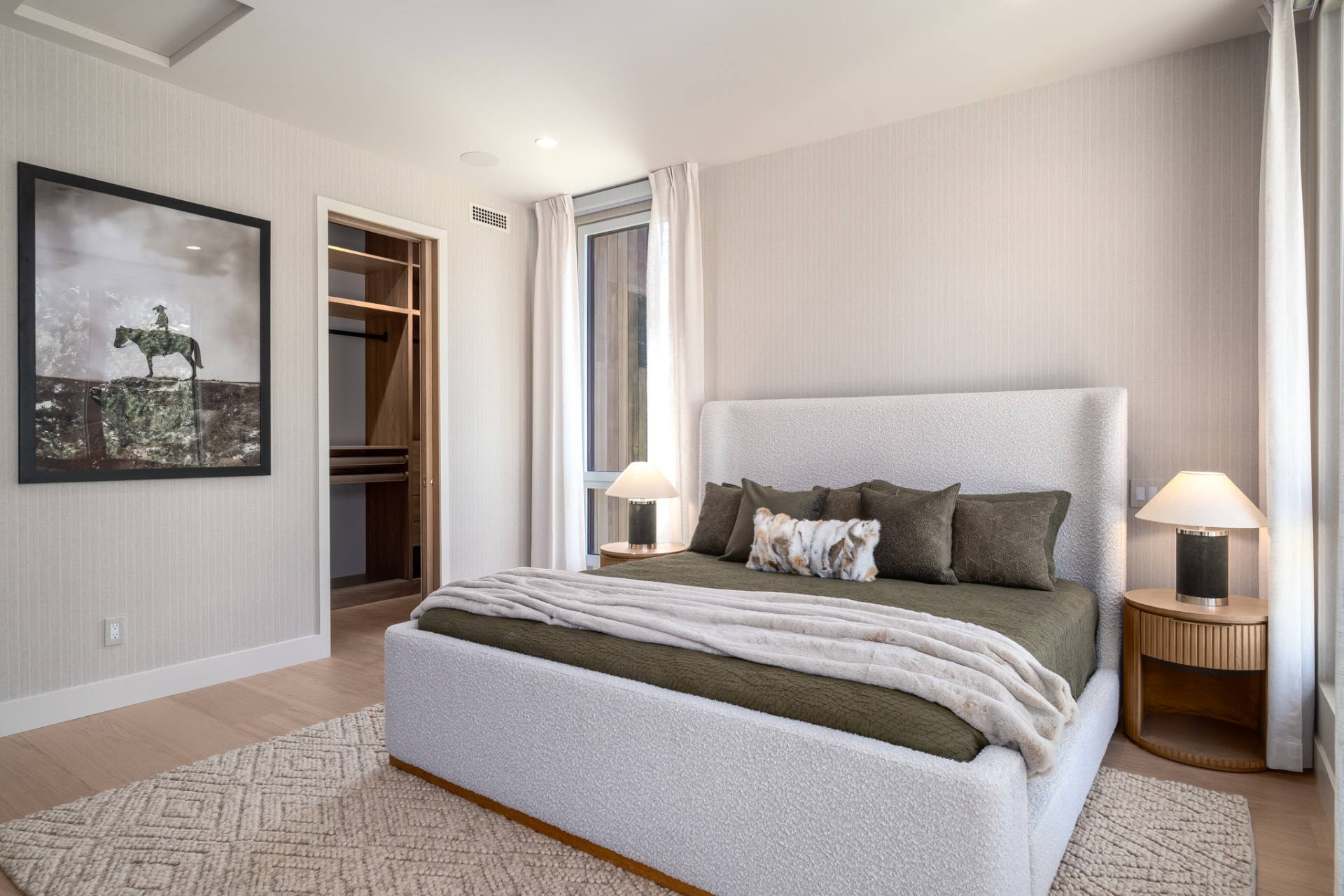 Guest suite with upholstered king bed, walk-in closet and layered mountain textiles